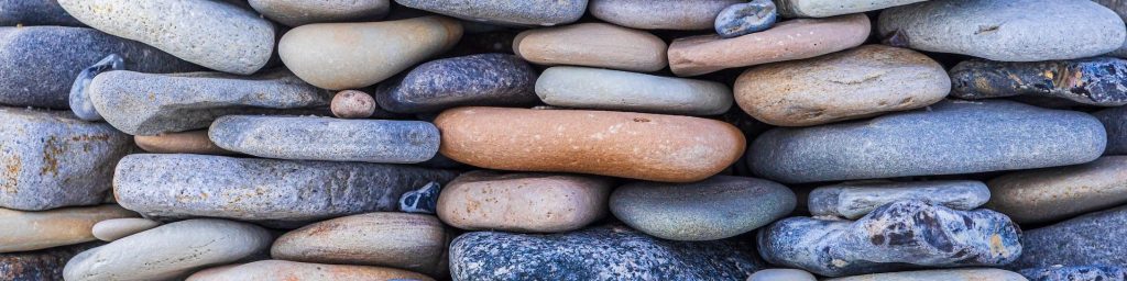 Sage Scifi: We Must Be Connected - Stones stacked together in a symbol of trust 